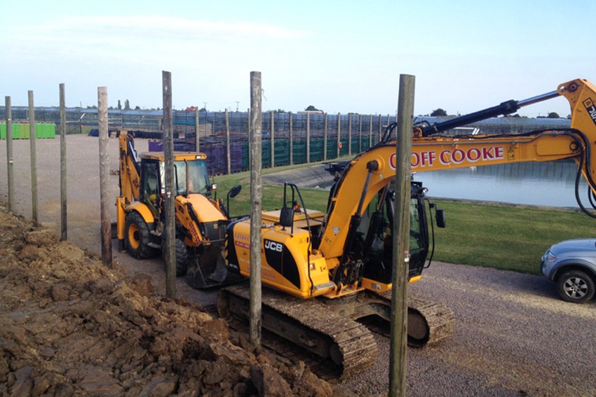 Geoff Cooke JCB and excavator setting fence posts
