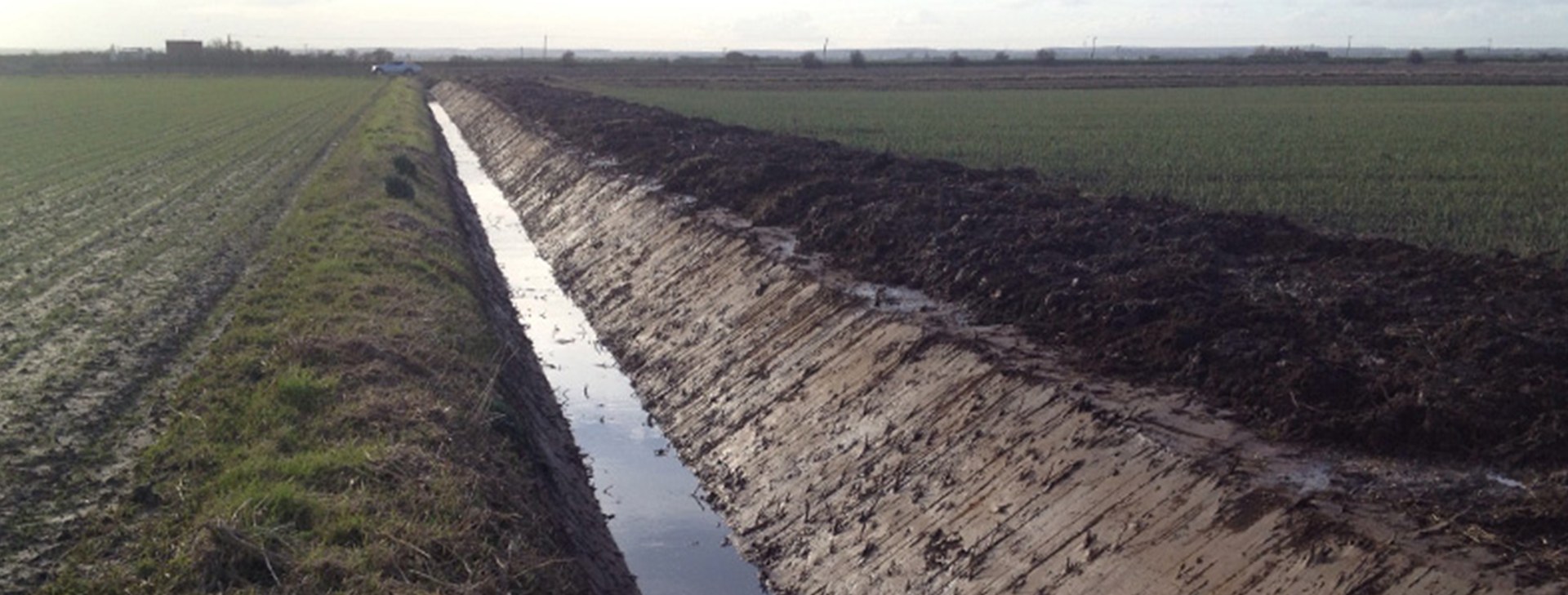 Long new-cut ditch running across flat Lincolnshire farmland