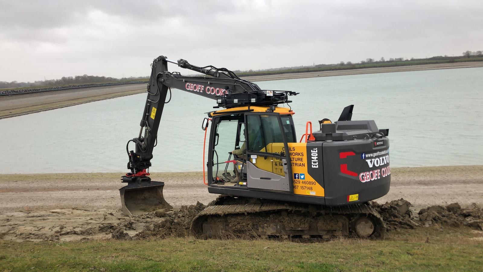 Geoff Cooke Volvo excavator working at the edge of a reservoir