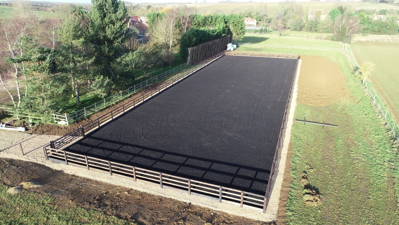 Aerial view of a finished black rubber arena, angle 1