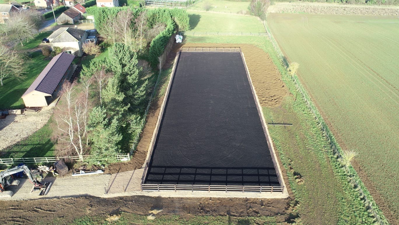 Aerial view of a finished black rubber arena, angle 3