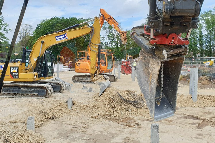 Foundation piles with two excavators on site